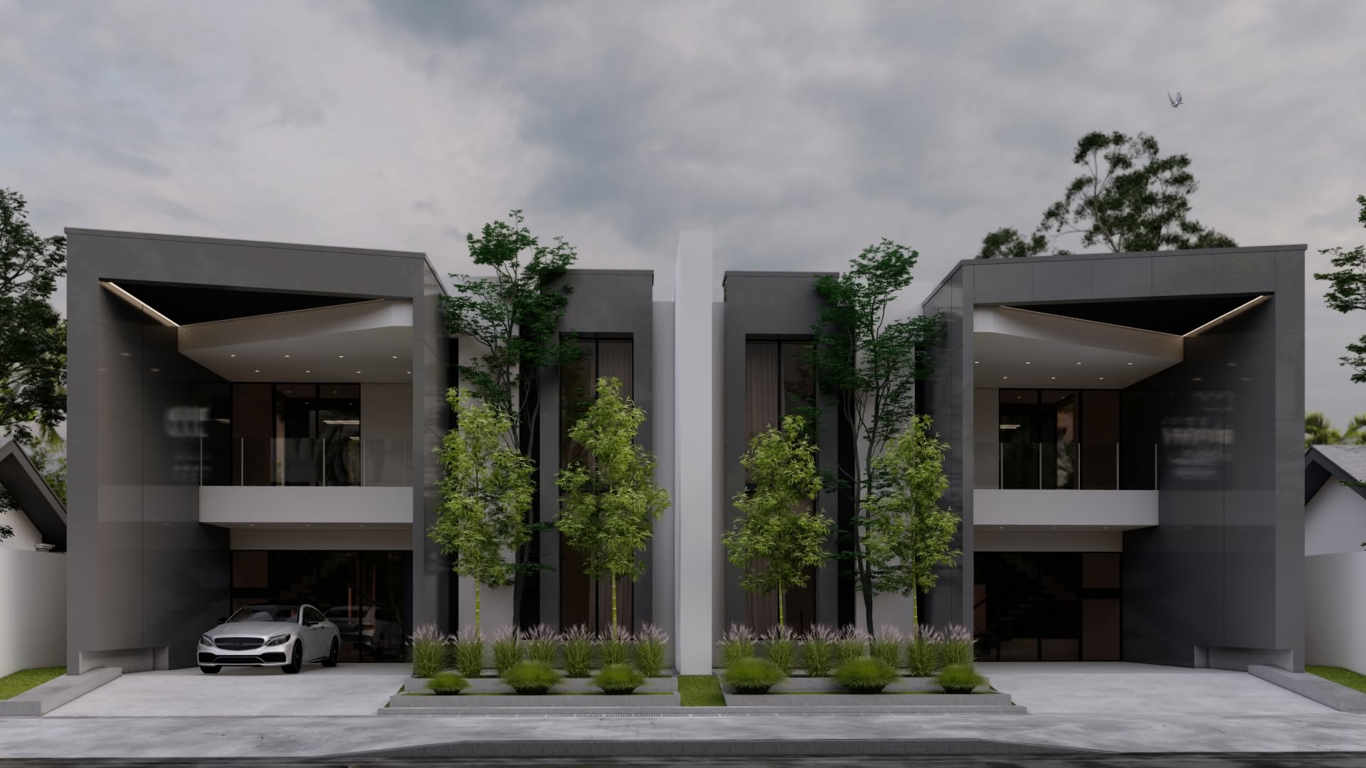 Dark grey mirrored twin houses separated by a white blade wall.